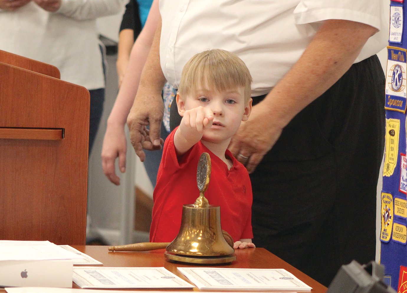 Mitchell Shell, 6, kicks off Thursday’s Kiwanis luncheon with the traditional ringing of the bell. During the meeting, Mitchell, a child with autism, received a new iPad pre-loaded with adaptive tools and applications designed to facilitate communication between Mitchell and loved ones, friends and teachers. Accompanied by his mother, Nicole Crombie, the pair were visibly grateful for the Kiwanis donation, which couldn’t be more apparent than through their smiles upon receiving the device.
